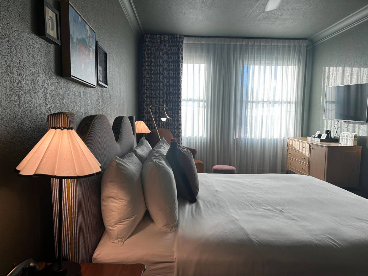 View of a bed at the MarQueen Hotel