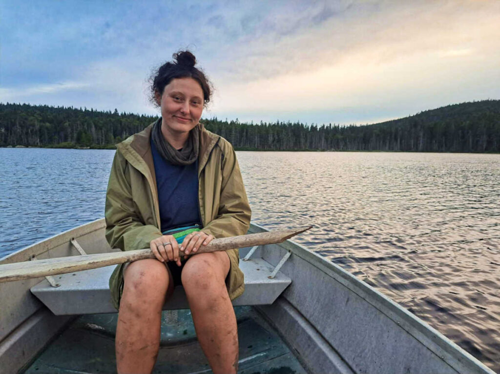The author Marina, relaxing on the rowboat at sunset