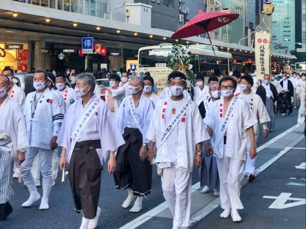 People walking in a parade at a Matsuri festival in Kyoto