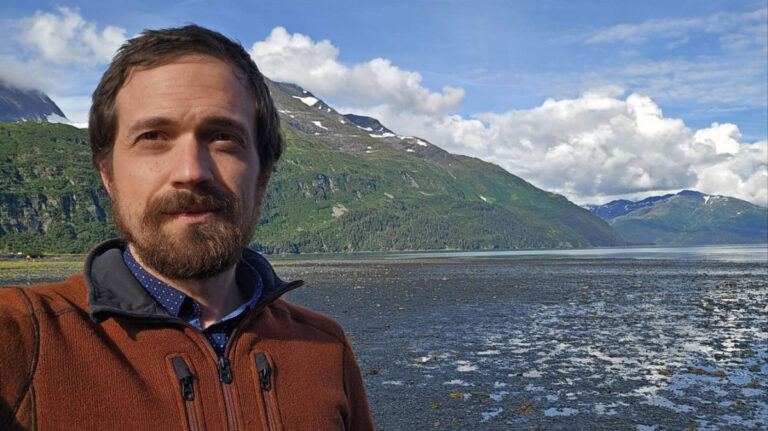 The author Matthew Reppond, standing by the beach near Whittier, Alaska