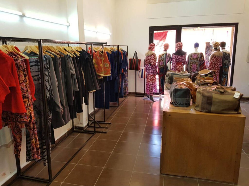 View of the colorful clothing in the Max & Jan Concept Store