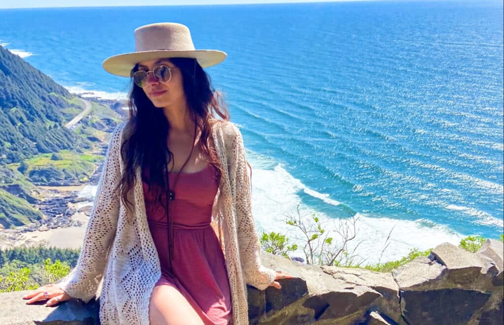 Travel Lemming Writer, McKenna posing at the Coastal Viewpoint