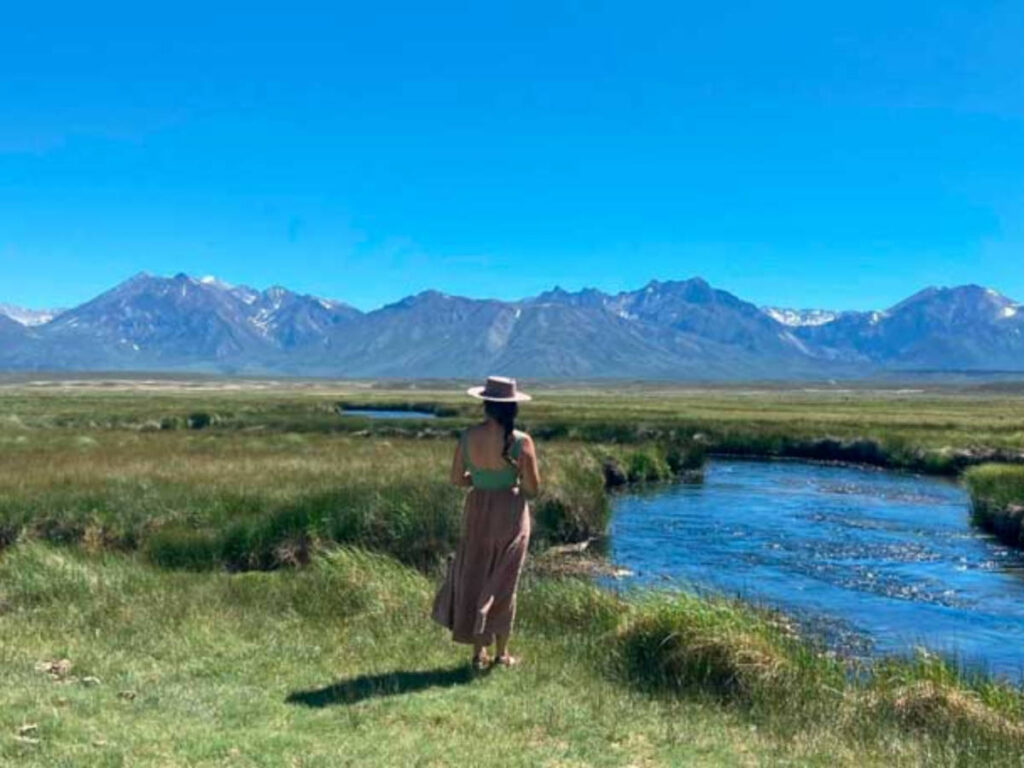 The author McKenna Mobley admiring a view of Owens River with mountains in the background
