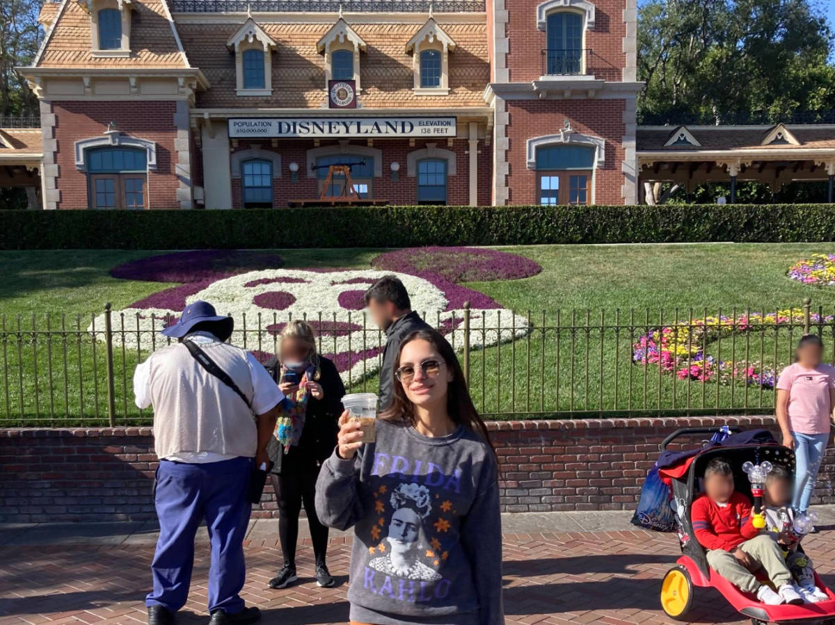 The author, McKenna Mobley holding her drink at Disneyland
