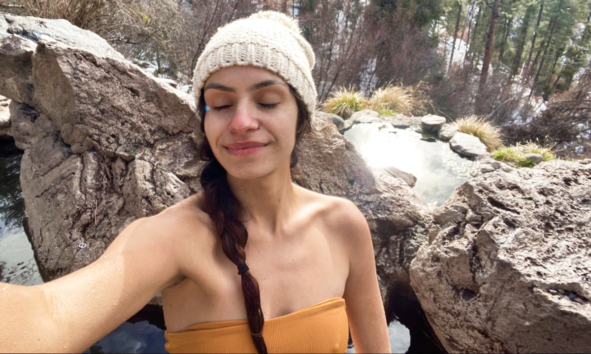 Travel Lemming Writer, McKenna soaking in the Natural Hot Spring at Winter