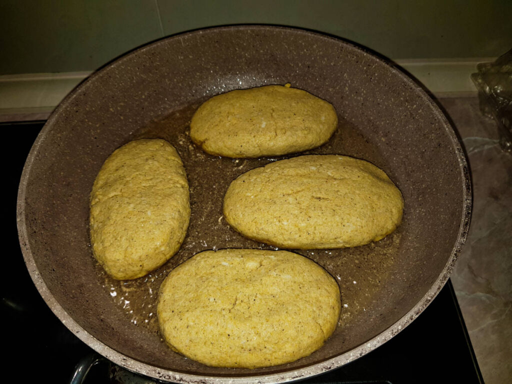 The cornbread cooking on the pan