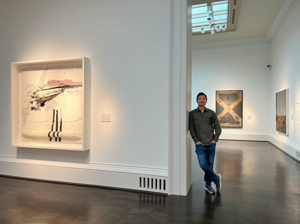 The author's partner posing for a photo inside the Meadows Museum