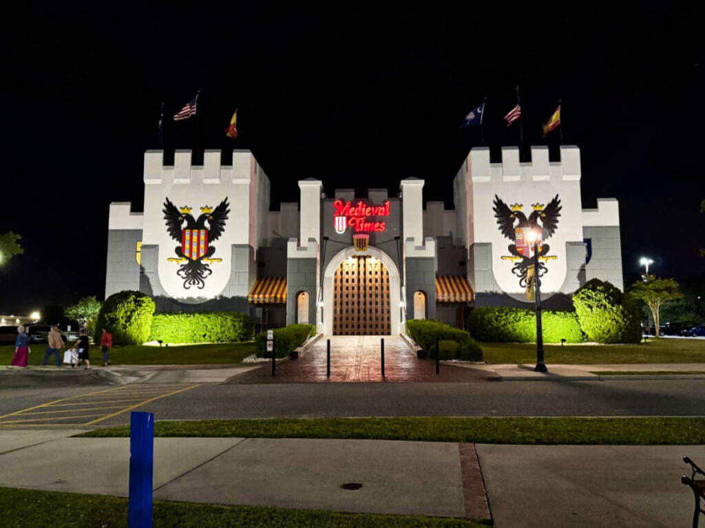 Exterior view of the Medieval Times Dinner Theatre at night