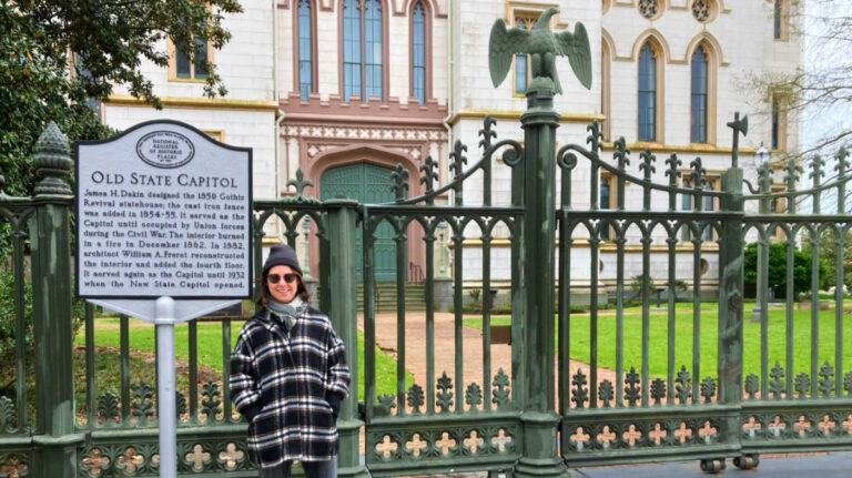 The author, Meg O'Connor, outside the Old State Capitol Museum in Baton Rouge, one of the best places to visit in Louisiana