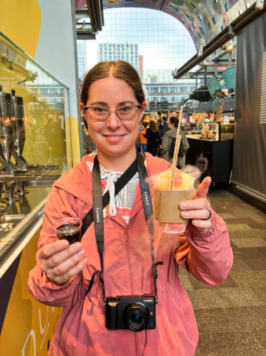 The author Meg O’Connor holding a cup of corn puffs frozen with liquid nitrogen
