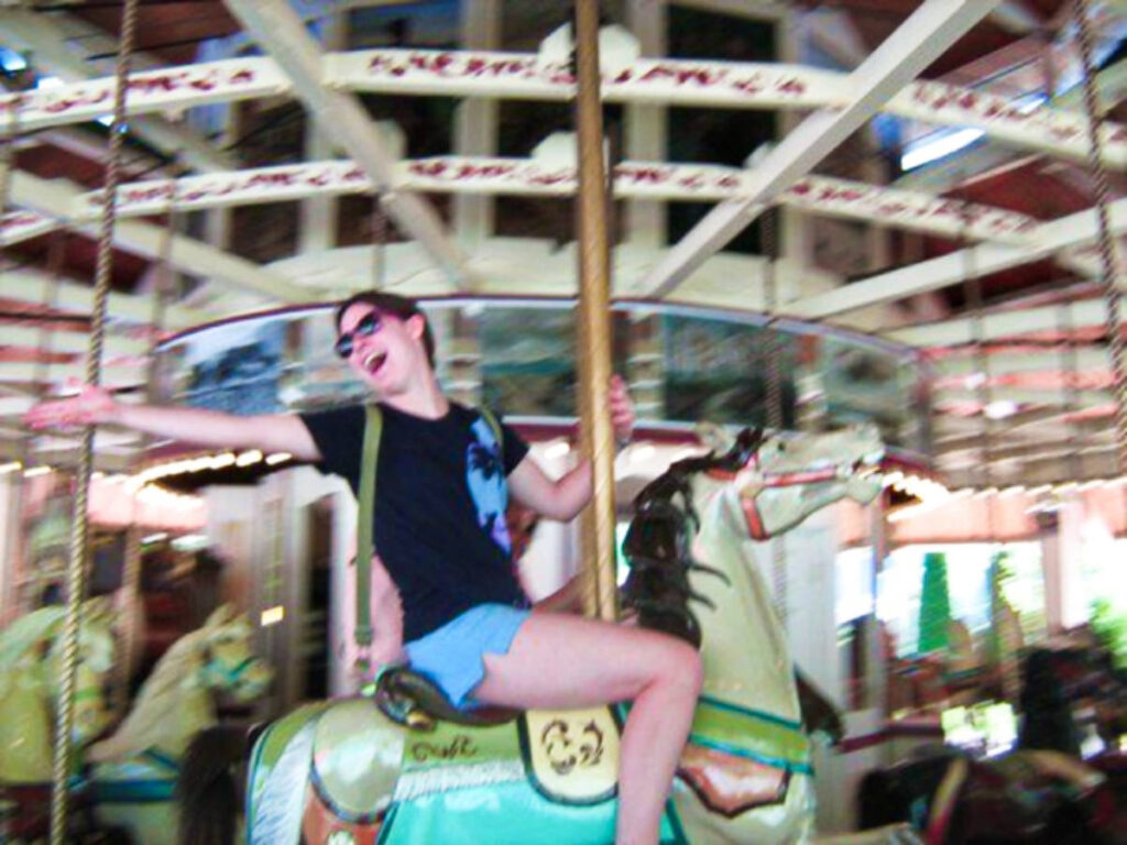 The author Meg O'Connor, riding the carousel at Lake Compounce