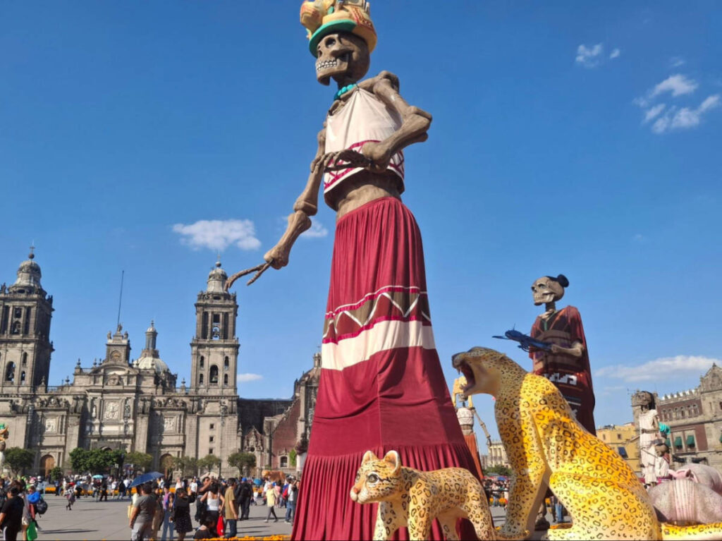 Closeup look of the “Mega Ofrenda” in the Zócalo with the Cathedral in the background