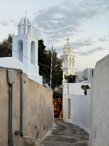 View of the central clock tower from a
sidestreet in Megalochori