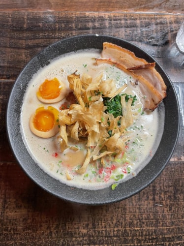 A bowl of Tori Paitan ramen with egg at Mensho Tokyo