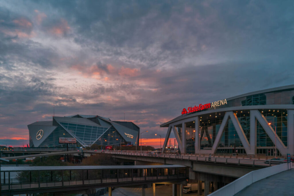 View of the Mercedes-Benz Stadium and the State Farm Arena at sunset