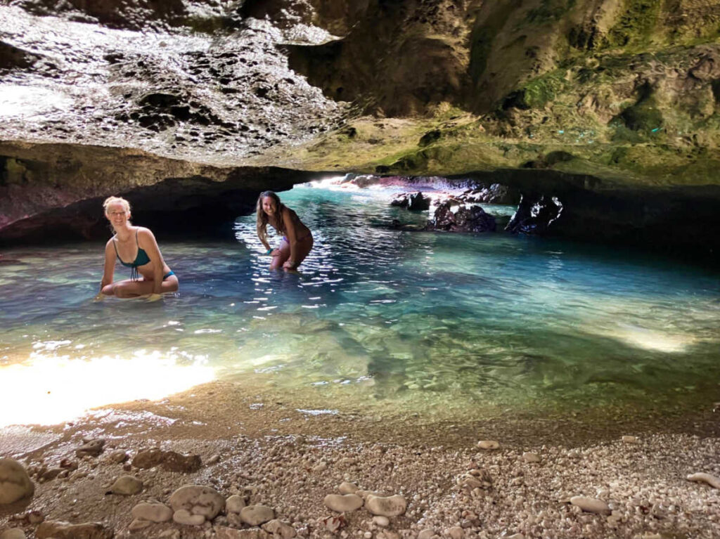The author Rebecca Parsons and her friend  swimming in the Mermaid Caves