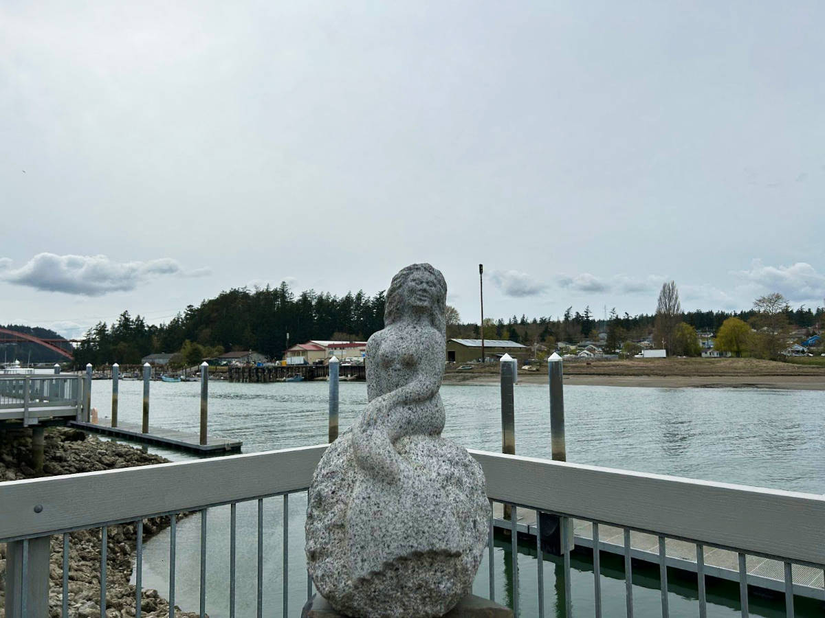A mermaid statue at the waterfront of by La Conner