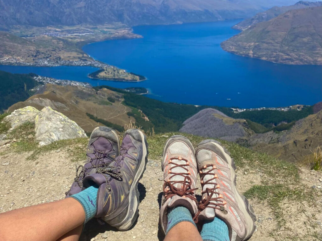 Author Laura and her partner wearing Merrell hiking boots while hiking in New Zealand