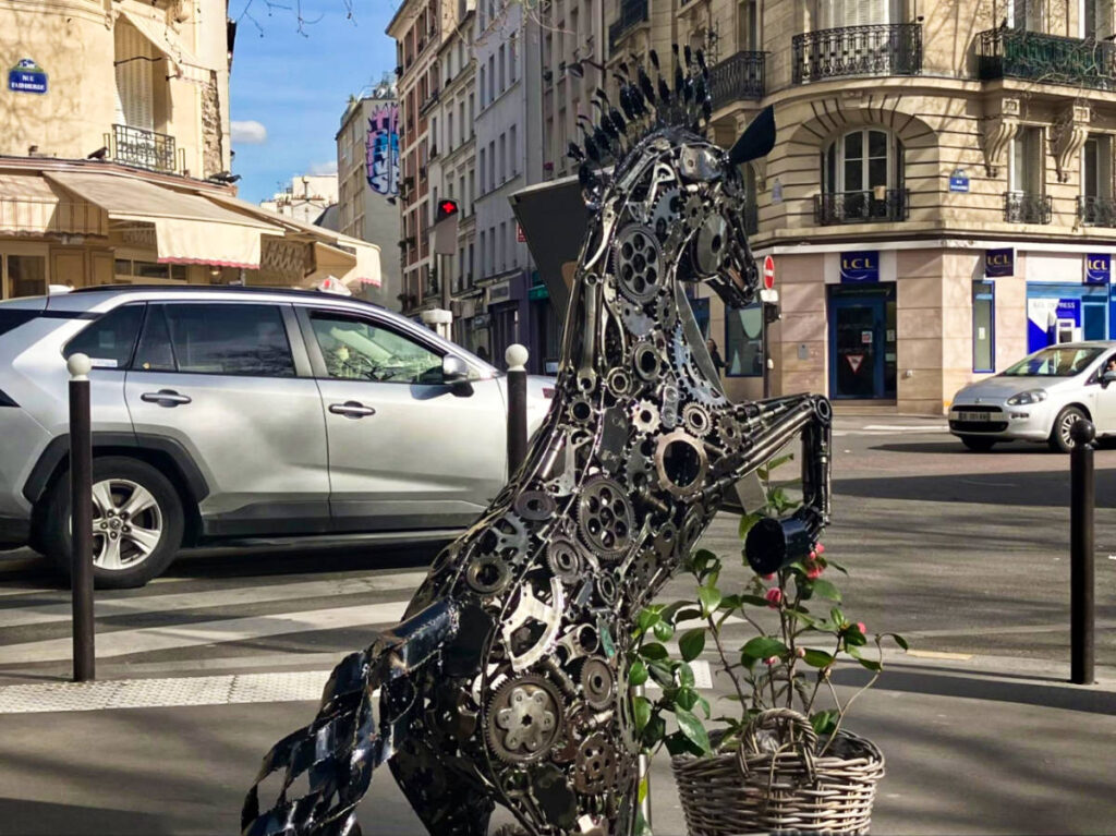 The metal horse sculpture in the street