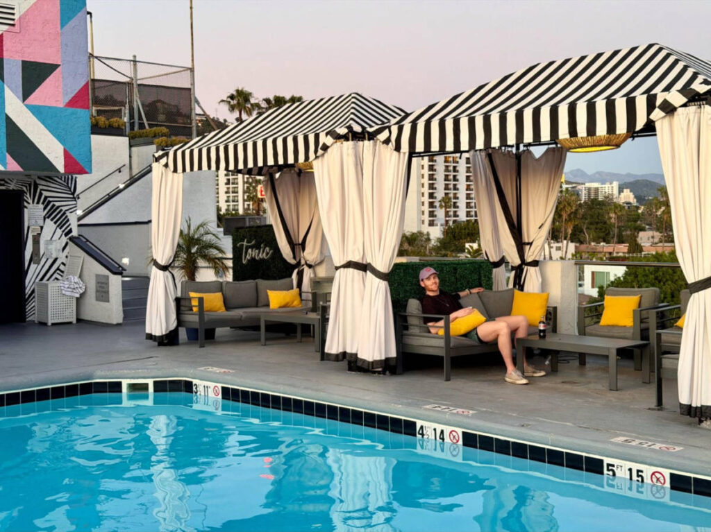 The author's partner relaxing by the rooftop pool in Montrose