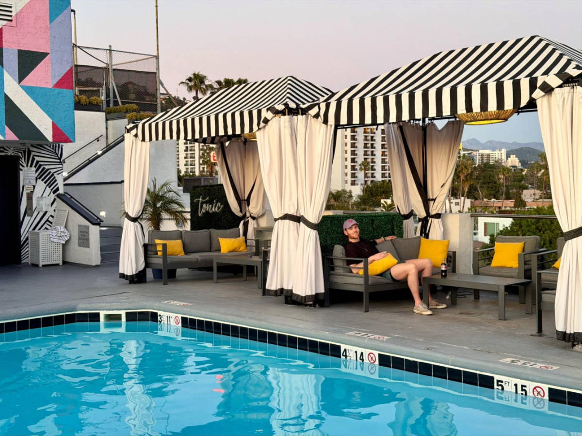 The author's partner relaxing by the rooftop pool in Montrose