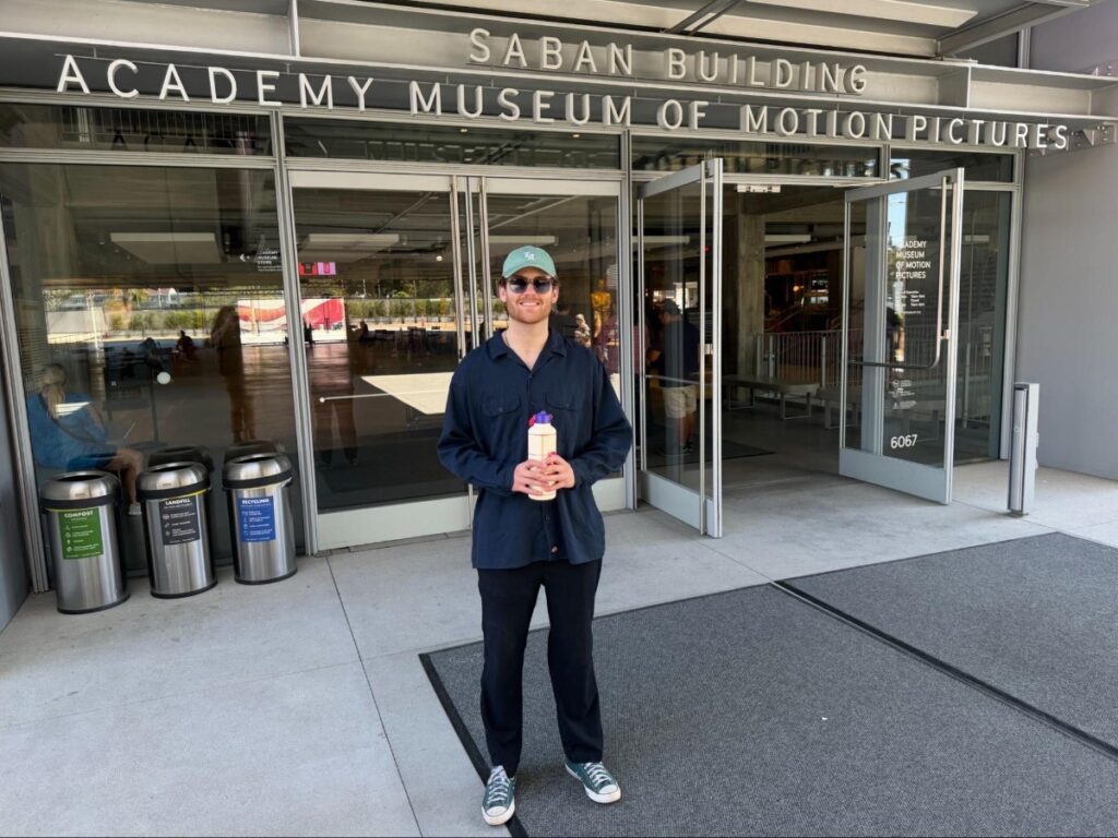 Michael standing in front of the Academy Museum of Motion Pictures entrance