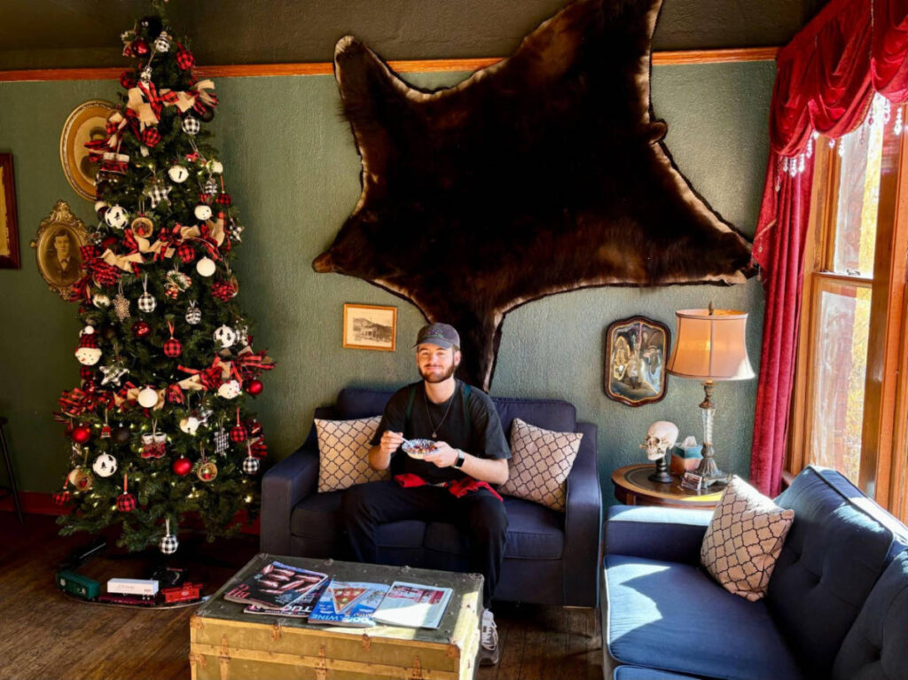Betty's partner, Michael enjoying her coffee at the common room at the Oliver House