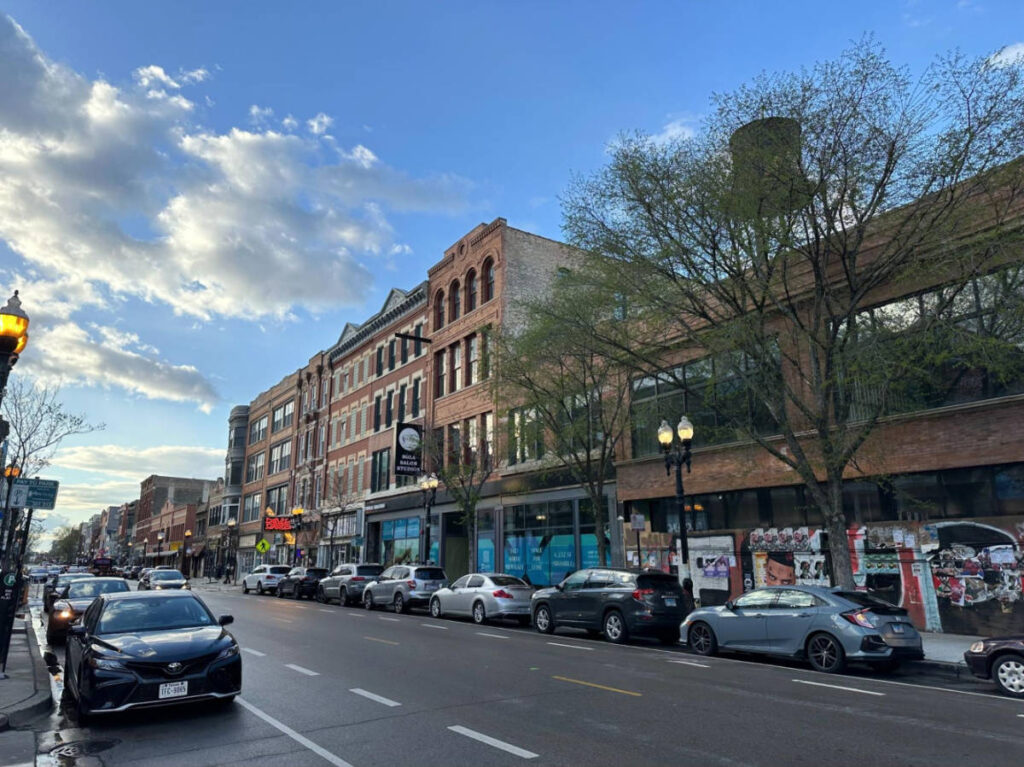 Cars parked along the street in Milwaukee Ave