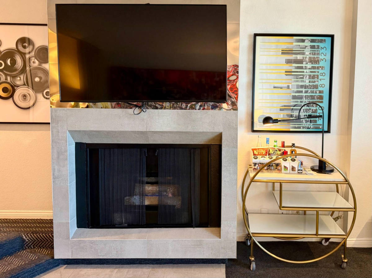 The mini bar and the fireplace in the hotel room