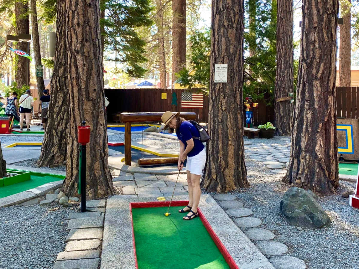 A woman playing the mini golf at the Kings Beach