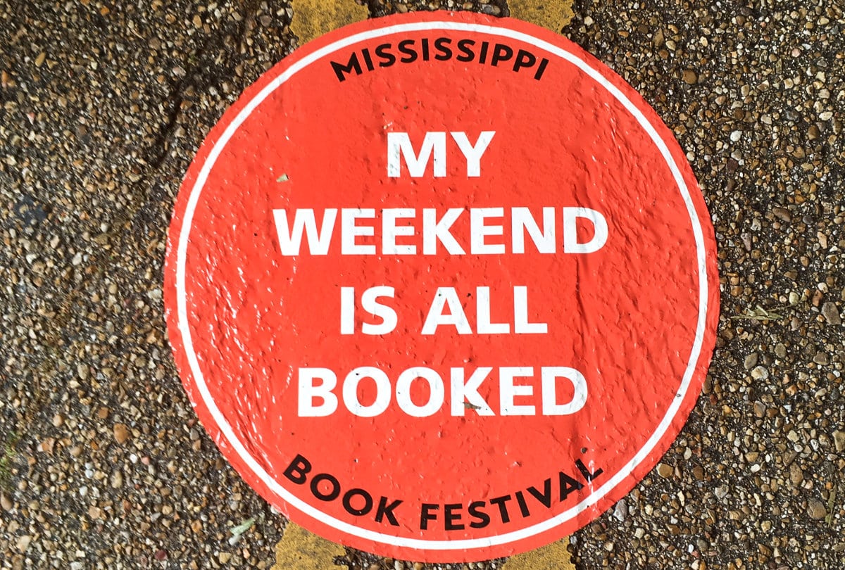 View of the signage of the Mississippi Book Festival sticked on the floor
