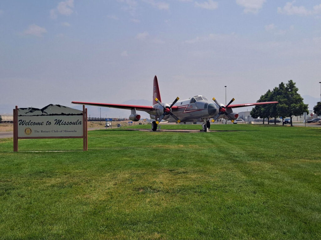 Welcome sign next to the airplane at Missoula’s airport