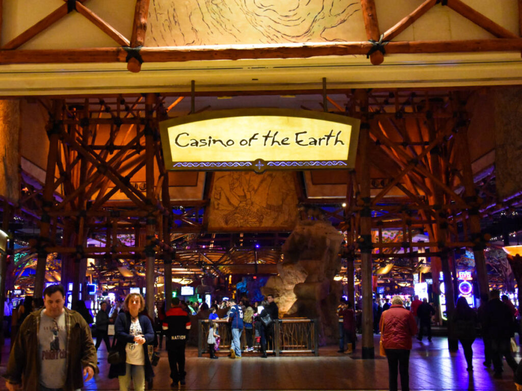 View of the "Casino of the Earth" sign and the crowd inside the Mohegan Sun Casino