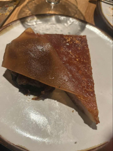 A plate with pork dish from Morchella 