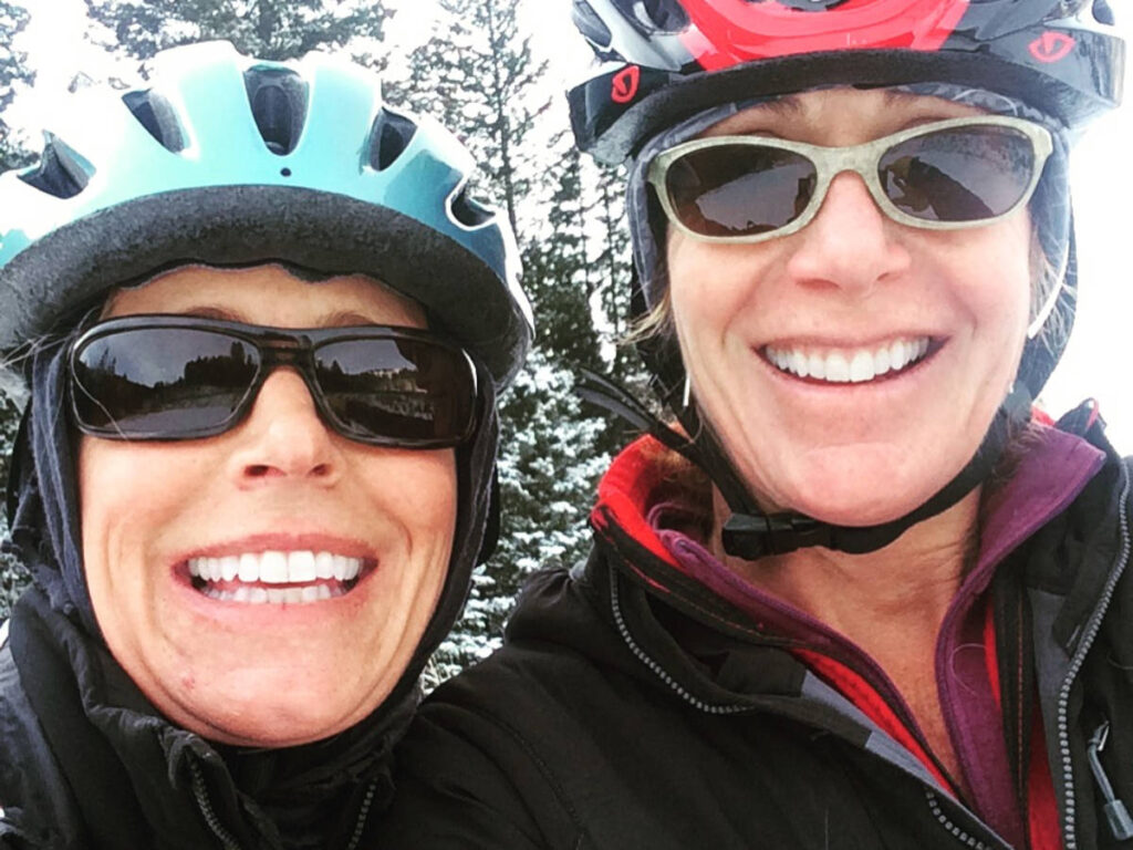 The author Morri Stewart and her bestie on a fat-tire ride