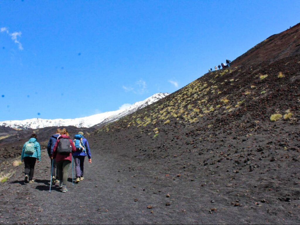 People hiking up to the Mount Etna