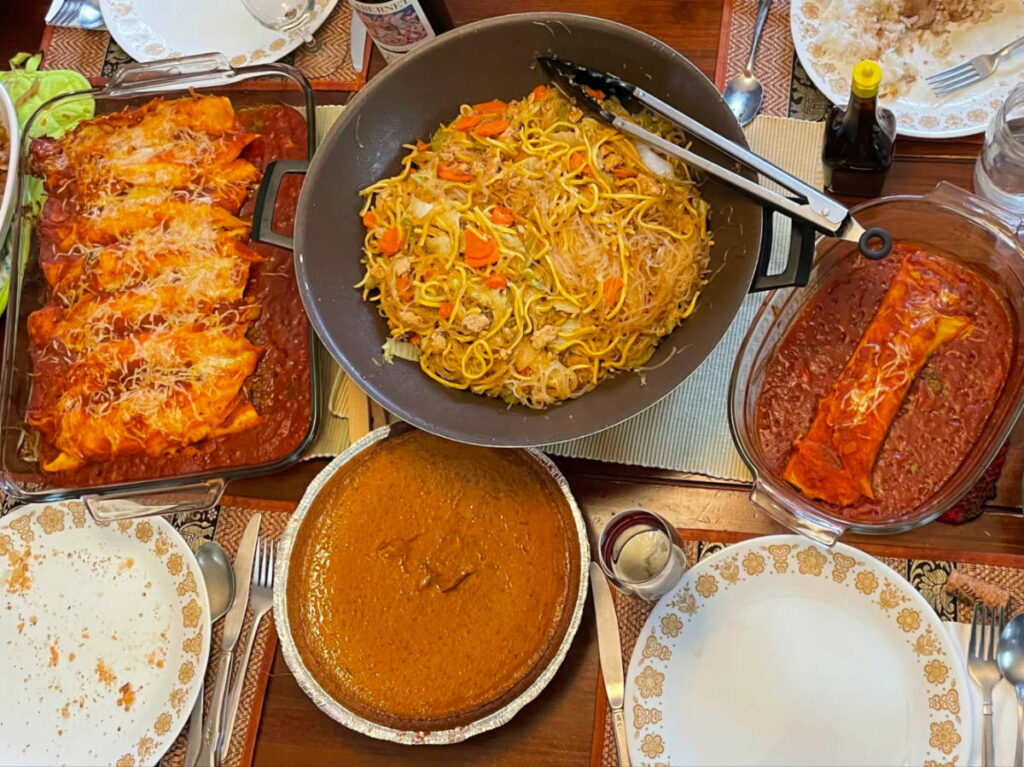 Top view of Multicultural Thanksgiving with Filipino, Brazilian, and American dishes
