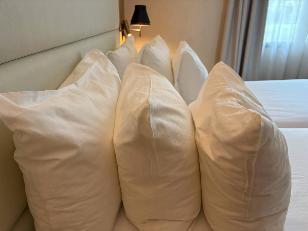 View of the multiple densities of pillows in the hotel room