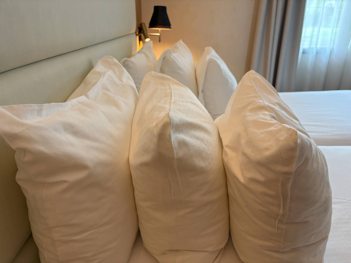 View of the multiple densities of pillows in the hotel room