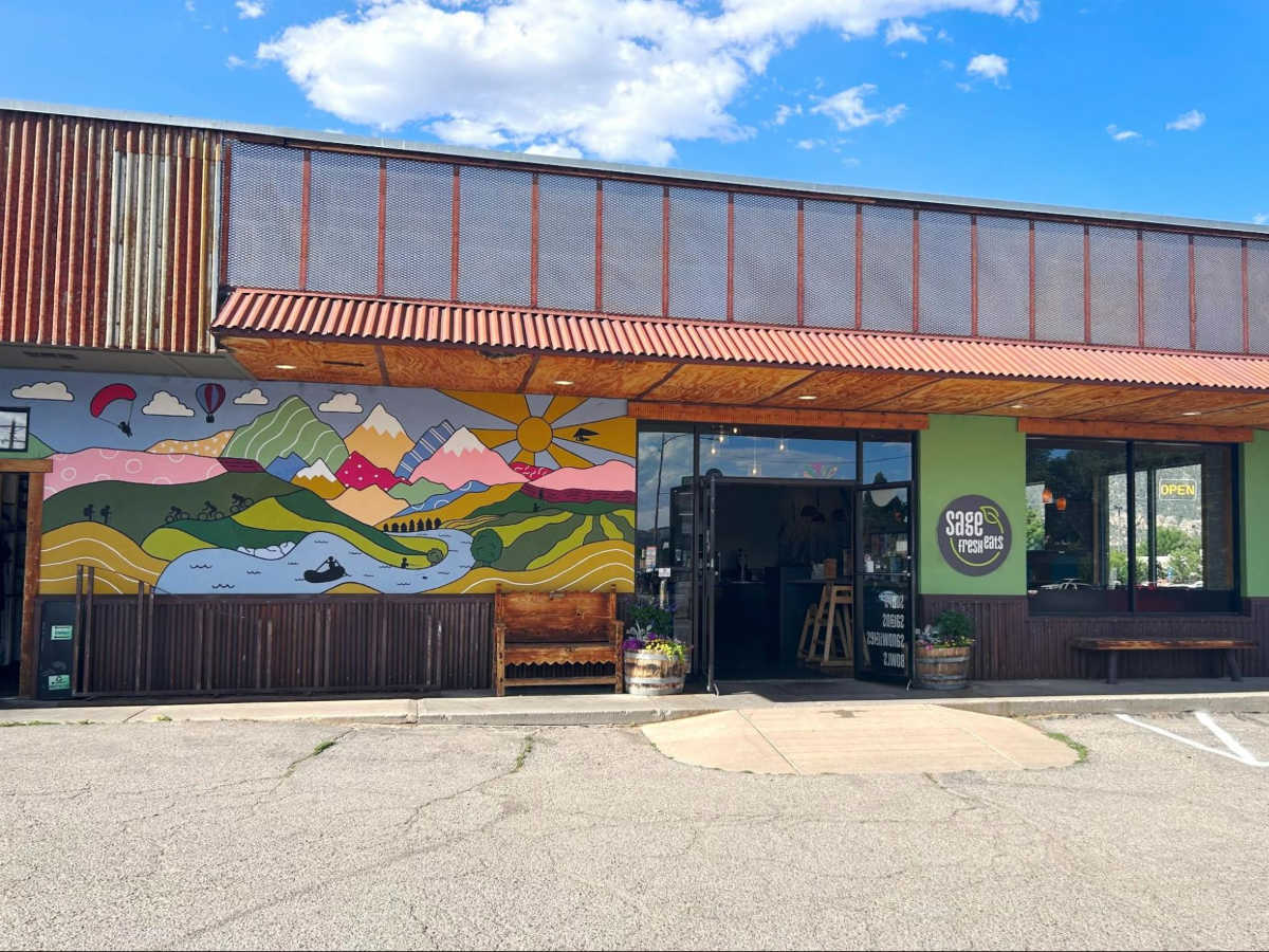 View of the colorful mural outside Sage Fresh Eats