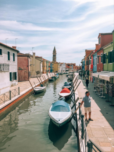 View of the colorful houses and boats in Murano