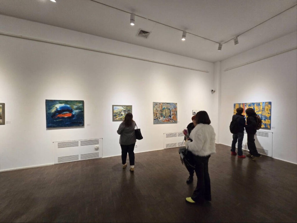 People admiring arts displayed at the Museum of Modern Art