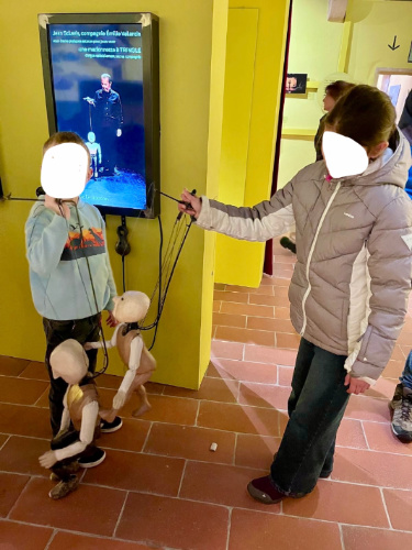 Kids playing puppets at the Museum of the Art of Puppetry