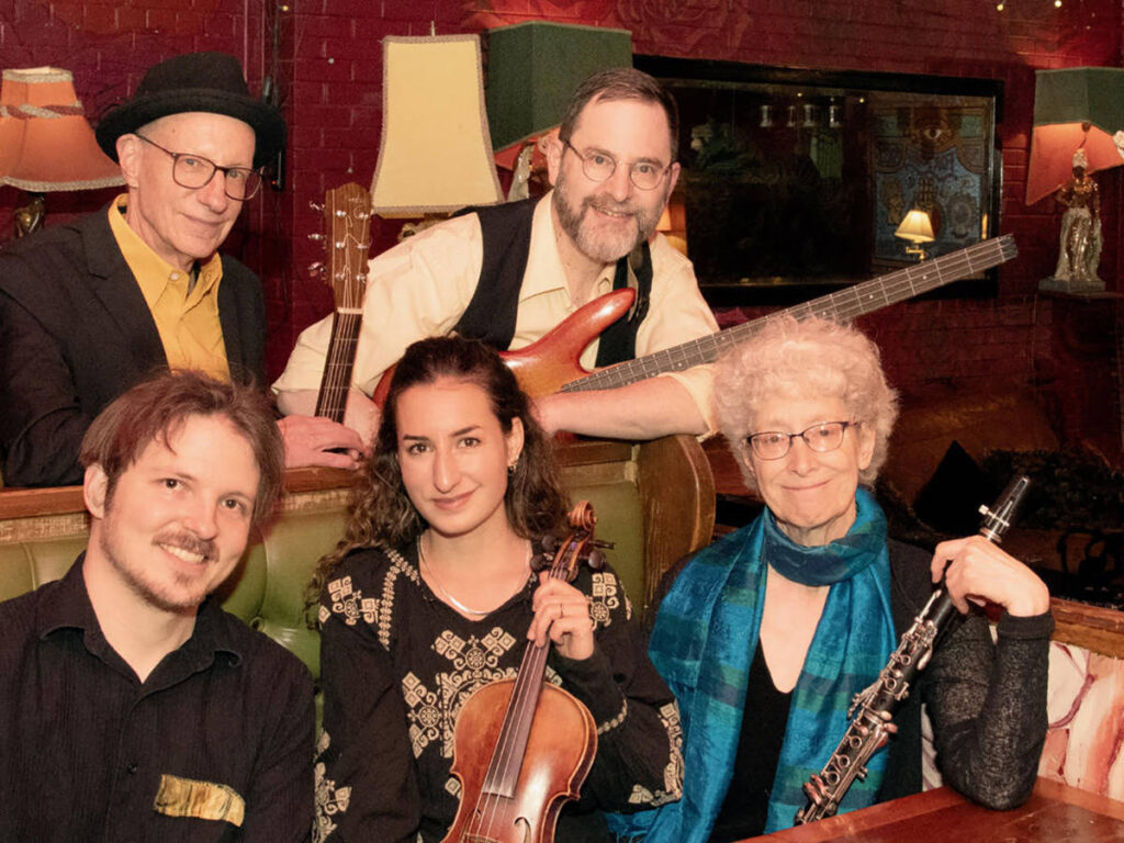Musicians at LatkePalooza smiling for a photo