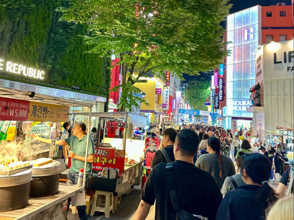 The crowded Myeongdong Walking Street surrounded by street foods and shopping areas