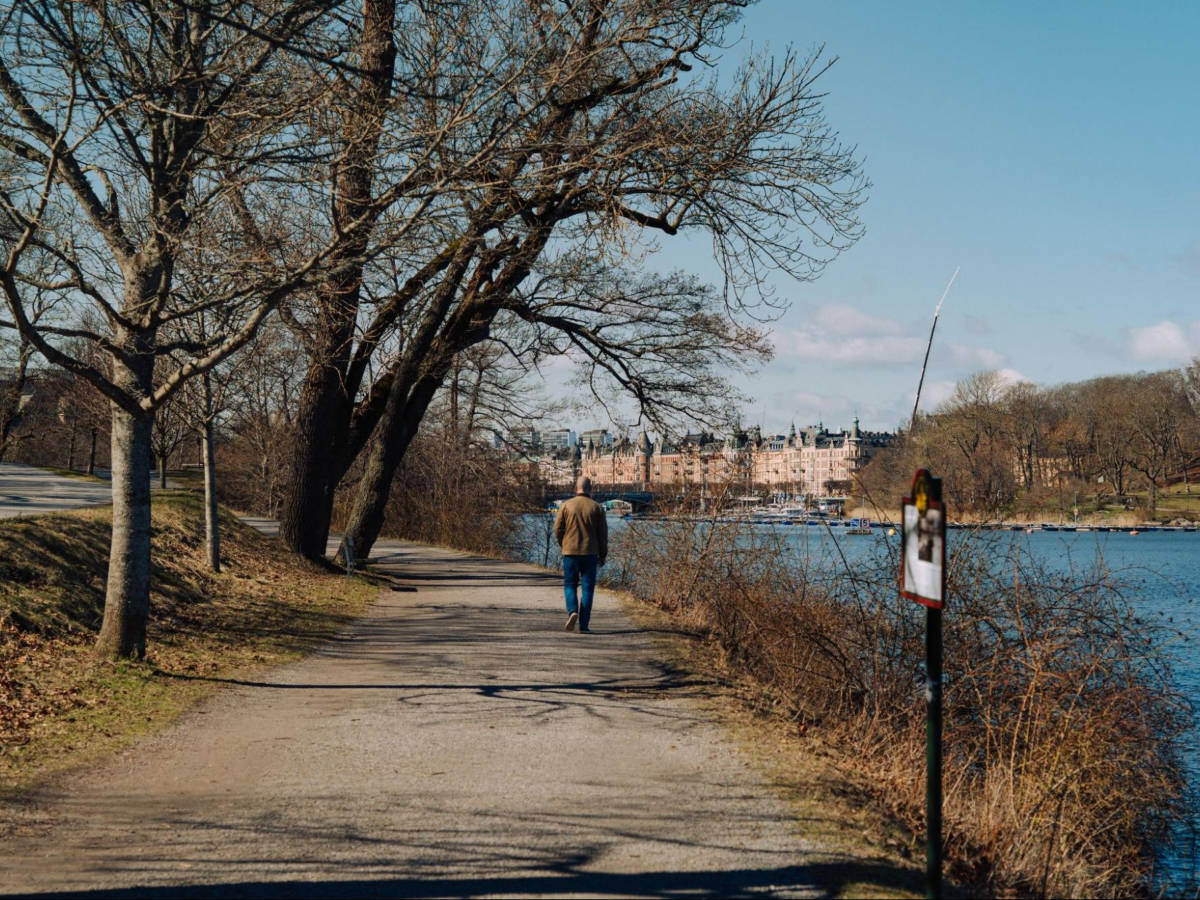A man walking along the paths on Djurgården