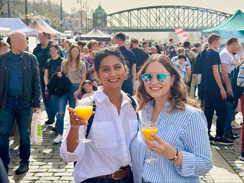 Author Meera and her friend enjoying a drink at the Naplavka Farmer’s Market