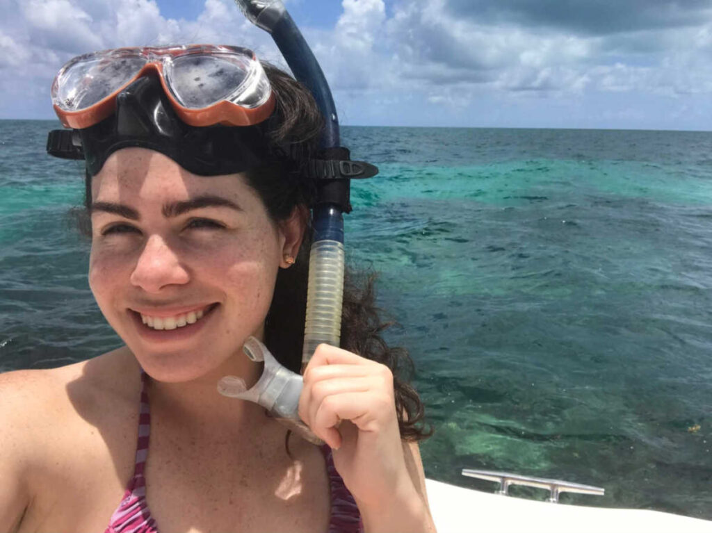 The author Natalie Becerra wearing a mask and snorkel at the beach