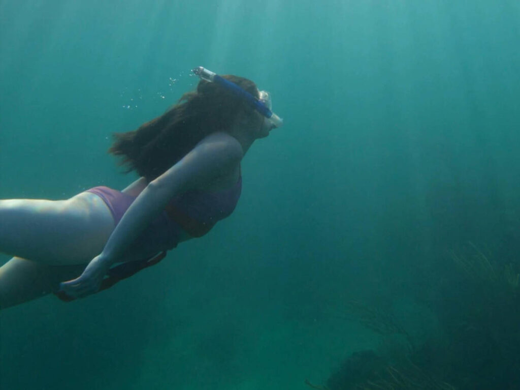 The author Natalie Becerra snorkeling in Key Largo