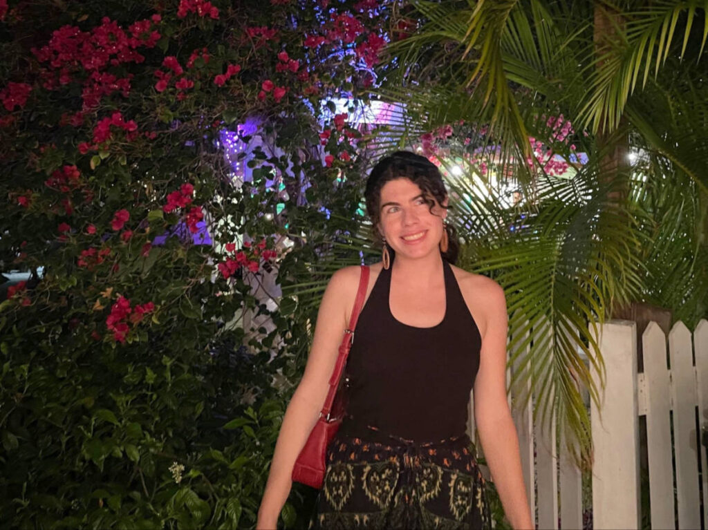 The author Natalie Becerra posing for a photo outside the Morada Way Third Thursday Art Walk